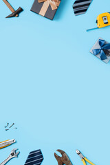 Top view design concept of Father's day with working tools on blue background.