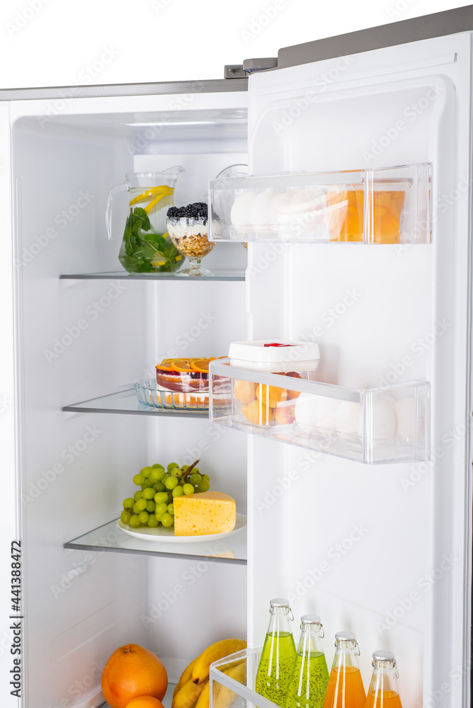 Open fridge full of fresh fruits and vegetables Open fridge full of fresh fruits and vegetables