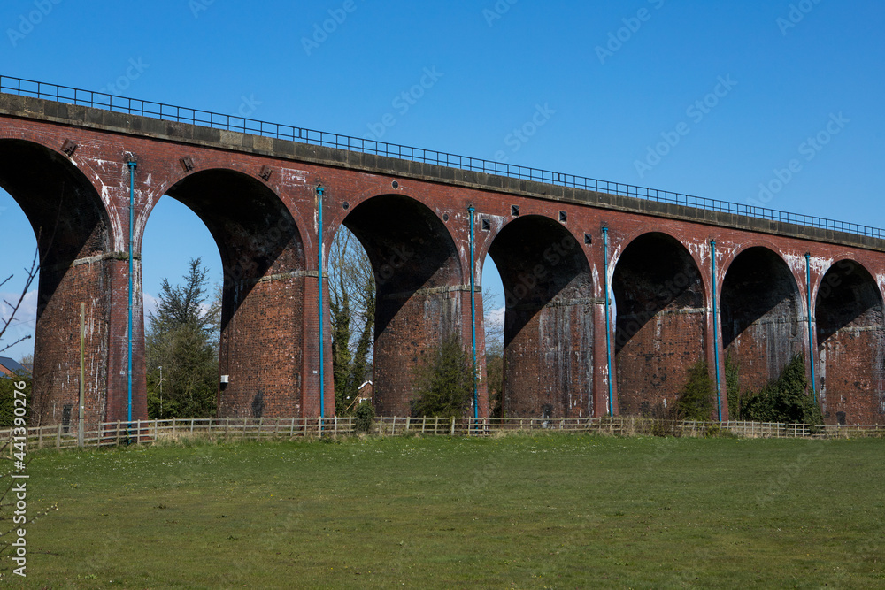 Whalley arches. Red brick train viaduct in the ribble valley. UK railway scene