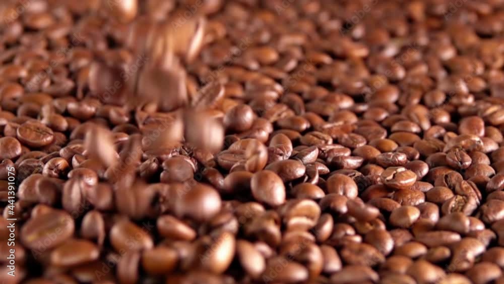 Few Coffee Beans are Falling on a Heap. Slow Motion