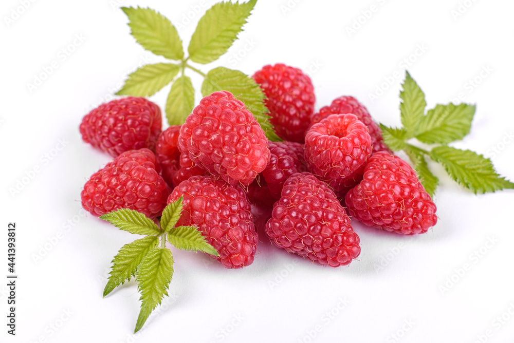 Ripe raspberries with raspberry leaf isolated on a white background Ripe raspberries with raspberry leaf isolated on a white background
