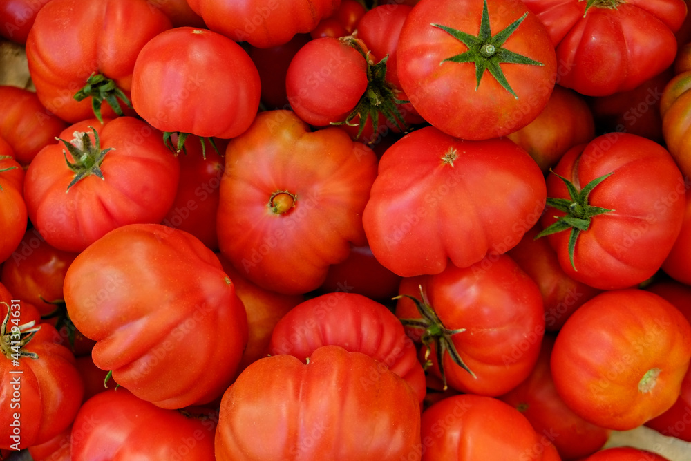 Clean eating concept. Bunch of ripe juicy freshly picked organic cherry tomatoes in pile at local produce farmers market. Healthy diet for spring summer detox. Vegan raw food. Close up, background. Clean eating concept. Bunch of ripe juicy freshly picked organic cherry tomatoes in pile at local produce farmers market. Healthy diet for spring summer detox. Vegan raw food. Close up, background.