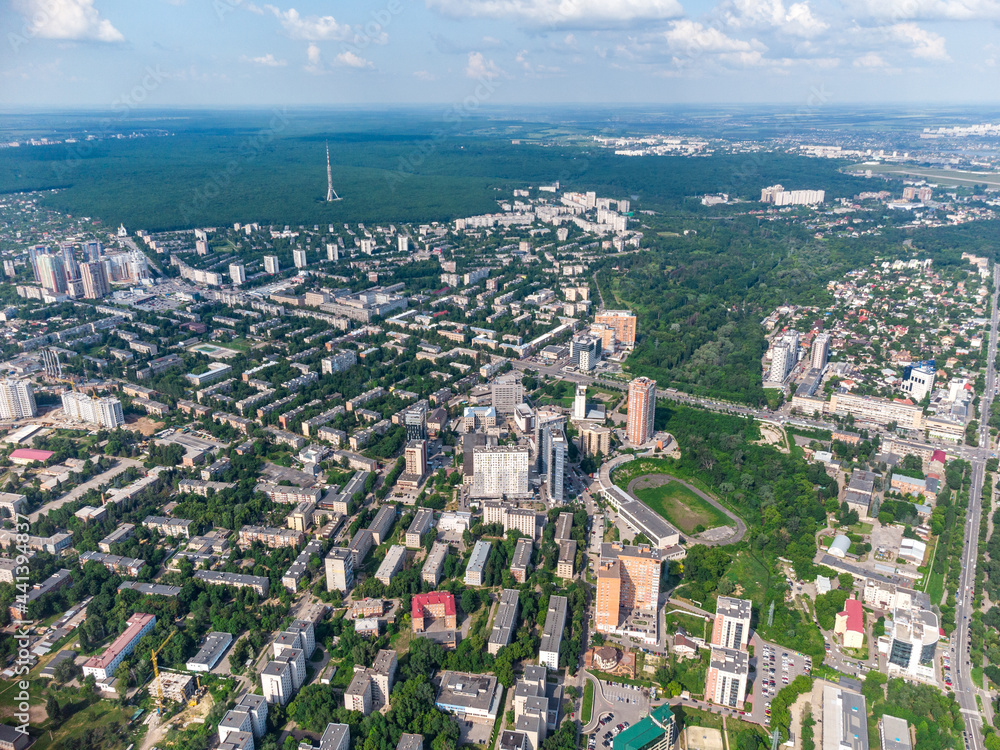 Aerial view on green summer Kharkiv city center, Pavlovo pole and park. Botanical garden Sarzhyn Yar and multistory modern high residential buildings on bright sunny day Aerial view on green summer Kharkiv city center, Pavlovo pole and park. Botanical garden Sarzhyn Yar and multistory modern high residential buildings on bright sunny day