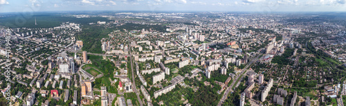 Aerial panorama view on green summer Kharkiv city center, Pavlovo pole and park. Botanical garden and multistory modern high residential buildings on bright sunny day