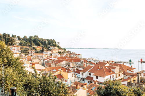 A panoramic of old town Piran, Slovenia. View over the tiled roofs of Piran and the Adriatic Sea.