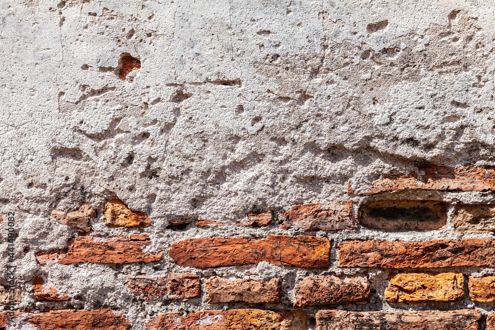 Fototapeta premium Vintage brown stone brick wall pattern and background seamless