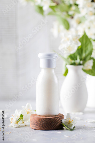 Cosmetic detergent with jasmine extract. Mockup of cream  shampoo  soap.