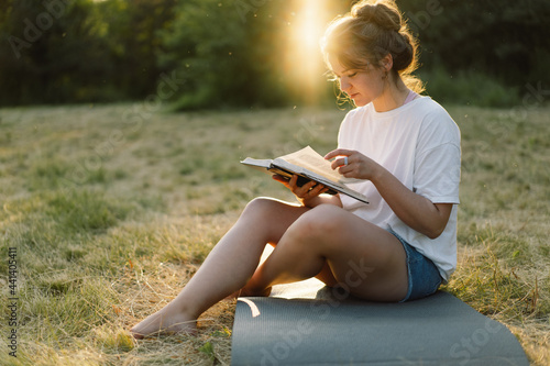 Canvas Print Christian woman holds bible in her hands