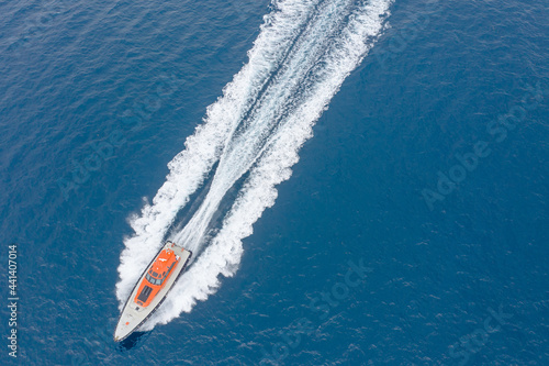 Looking down on pilot boat speeding through the water