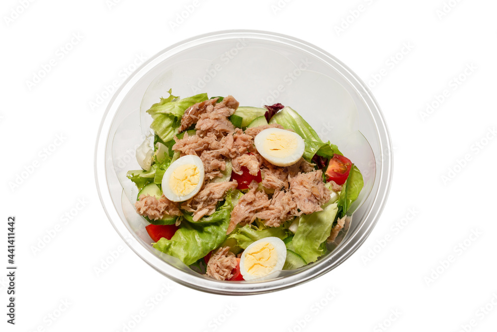 Fresh tuna salad with lettuce, cucombers, cherries and eggs in plastic container. Fresh tuna salad with lettuce, cucombers, cherries and eggs in plastic container.