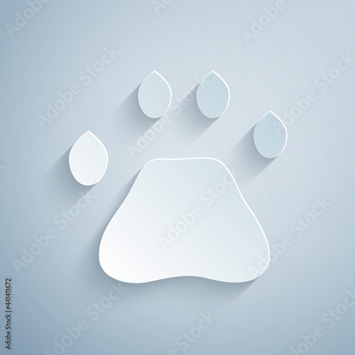 Paper cut Bear paw footprint icon isolated on grey background. Paper art style. Vector