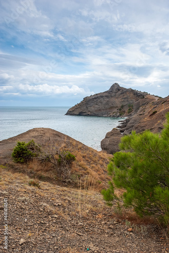 Crimean peninsula. Mountain Dragon against the backdrop of the Black Sea and a beautiful sky.