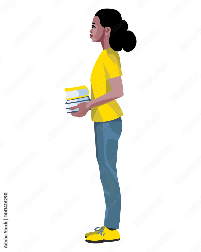 Black teenage schoolgirl stands and holds a stack of books in her hands Black teenage schoolgirl stands and holds a stack of books in her hands