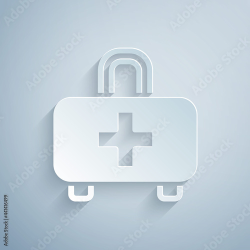 Paper cut First aid kit icon isolated on grey background. Medical box with cross. Medical equipment for emergency. Healthcare concept. Paper art style. Vector