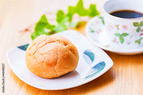 cream puff and coffee cup