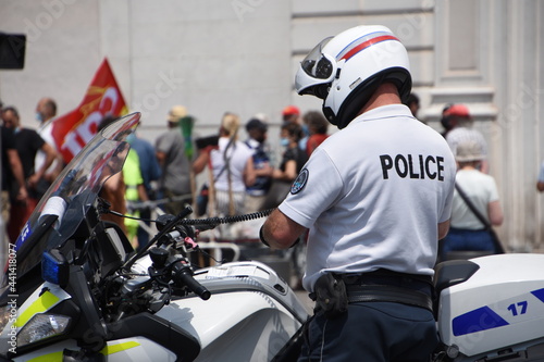 Close-up of a police officer and his motorbike