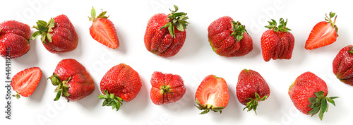 Banner of organic homegrown ugly strawberry on a white background. View from above. Concept eco products.