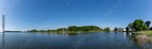 panorama view of the Maribo Lake in Denmark with the Sopark Hotel on the lakeside