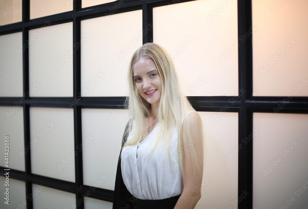 Fototapeta premium portrait of young happy woman looks in camera