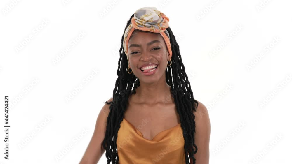 Portrait of a happy African woman showing her tongue. Isolated on a white background. Portrait of a happy African woman showing her tongue. Isolated on a white background.