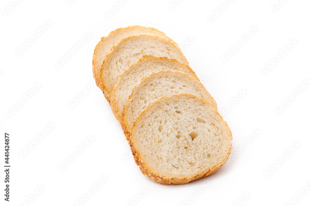 Slices of white bread or a loaf with sesame seeds isolated on a white background.