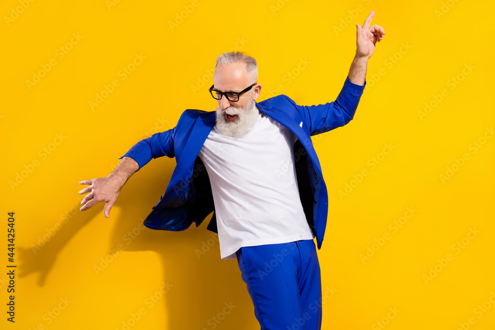Photo portrait of senior man in blue suit dancing at party isolated bright yellow color background - obrazy, fototapety, plakaty 