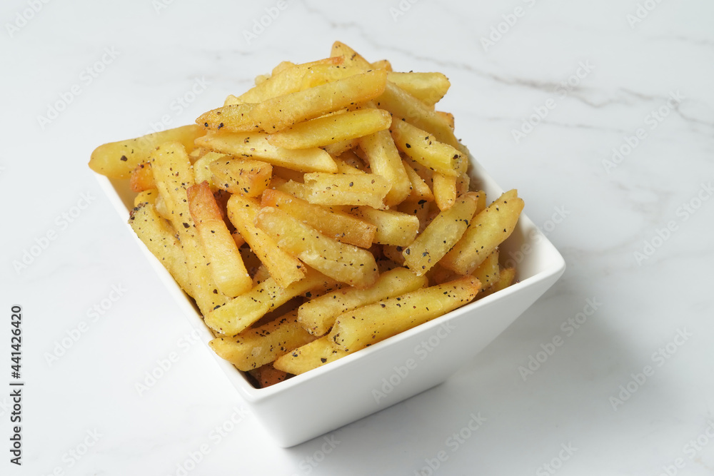 french fries in a white bowl french fries in a white bowl
