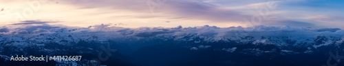 Aerial Panoramic View from Airplane of Canadian Mountain Landscape in Spring time. Colorful Sunset. North of Vancouver, British Columbia, Canada. Nature Panorama, Colorful Art Render