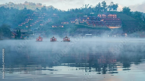 Time lapse of Tourists take a boat at Ban Rak Thai village in Mae Hong Son province, Thailand. photo