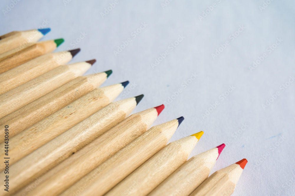 Obraz premium Kid Art education concept. Color pencils on white paper background. copy space