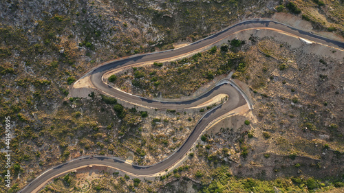 Aerial drone top down photo of serpentine winding asphalt road forming an "S" in uphill Mediterranean destination © aerial-drone