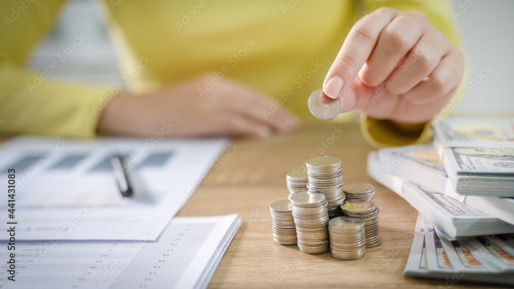 Fototapeta premium Saving money for new home. planning savings money of coins to buy a house concept for property