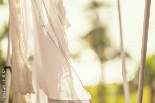 Obraz na plátně Closeup hanging laundry on balcony on the drying rack at sunset sunshine