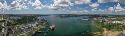Panorama of the ferry crossing, shipyard and seaport at Chernomorsk., Ukraine. Air drone footage, natural ligth.