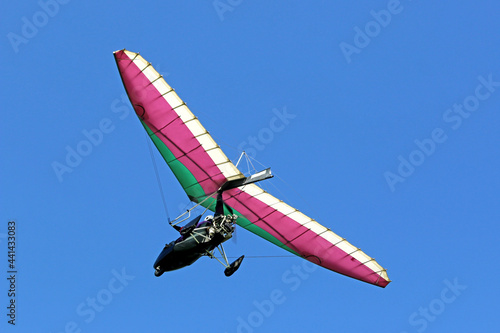 Canvas-taulu Ultralight airplane flying in a blue sky