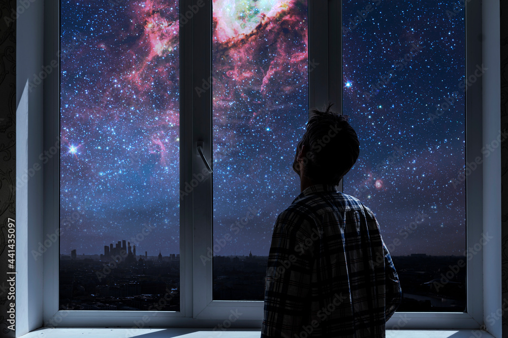 person standing next to the window and watching outside, admire the star on night sky, elements of this image furnished by nasa - obrazy, fototapety, plakaty 