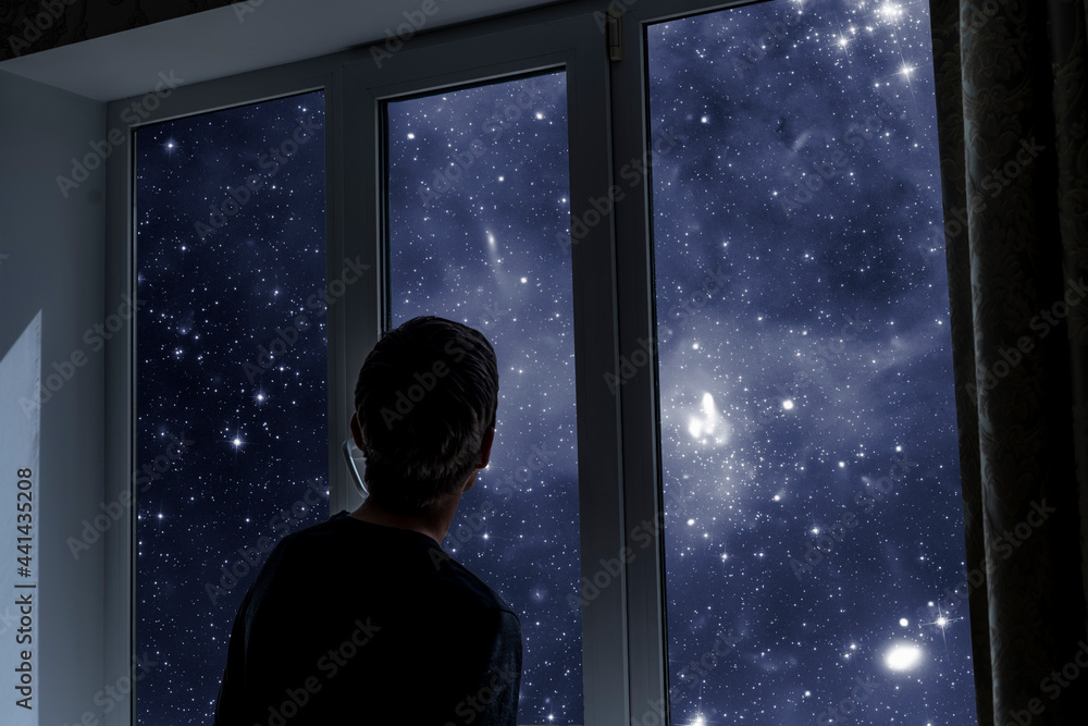 person standing next to the window and watching outside, admire the star on night sky, elements of this image furnished by nasa person standing next to the window and watching outside, admire the star on night sky, elements of this image furnished by nasa