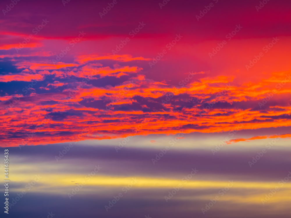 Multicolored clouds in the evening sky at sunset