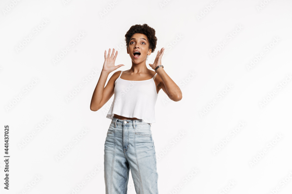 Young black woman in tank top expressing surprise at camera Young black woman in tank top expressing surprise at camera