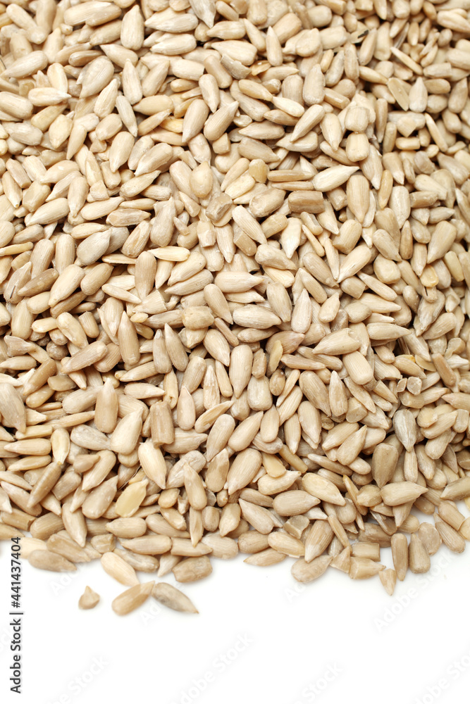 Peeled sunflower seeds pile on white background Peeled sunflower seeds pile on white background