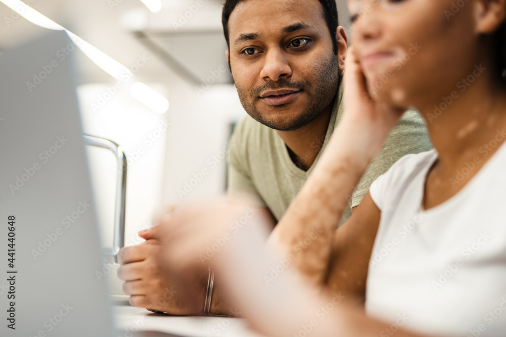 Obraz premium Mid aged multiethnic couple working together