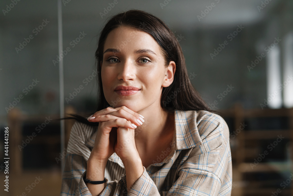 Close up of a young brunette white casual woman Close up of a young brunette white casual woman