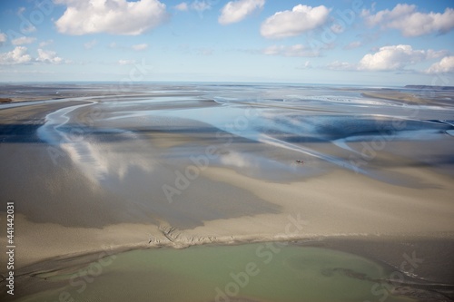 view from mont saint michel abbey on the bay at low tide