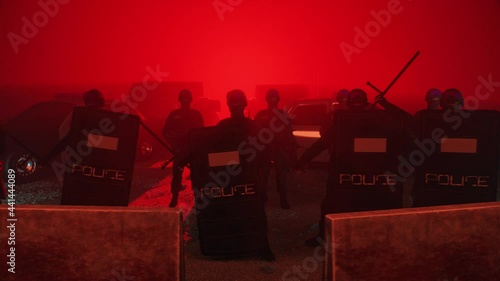 Riot Police standing ready at barricades