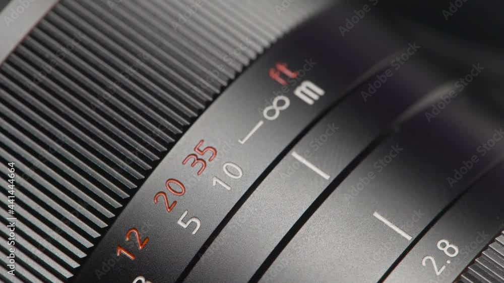 Close-up of ring with settings on lens. Action. Focal length and other ...