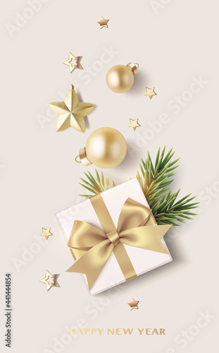 New Year and Christmas design template. Xmas background with decorative gold star, confetti, fir twig, balls and gift box isolated on light brown. Vector stock illustration.