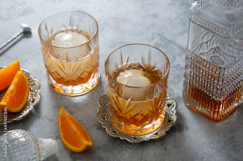 Whiskey, brandy or bourbon alcohol drink in crystal glasses photo