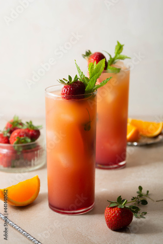 Pink lemonade with fresh strawberries  orange fruit and mint. Fresh summer fruit cocktails.