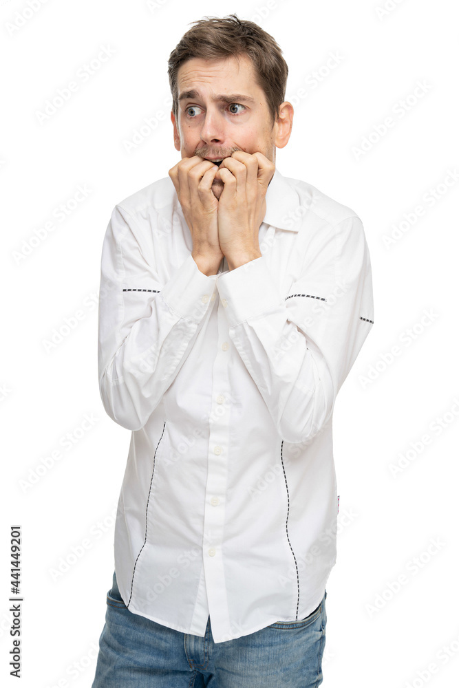 Young handsome tall slim white man with brown hair looks anxious in white shirt isolated on white background Young handsome tall slim white man with brown hair looks anxious in white shirt isolated on white background