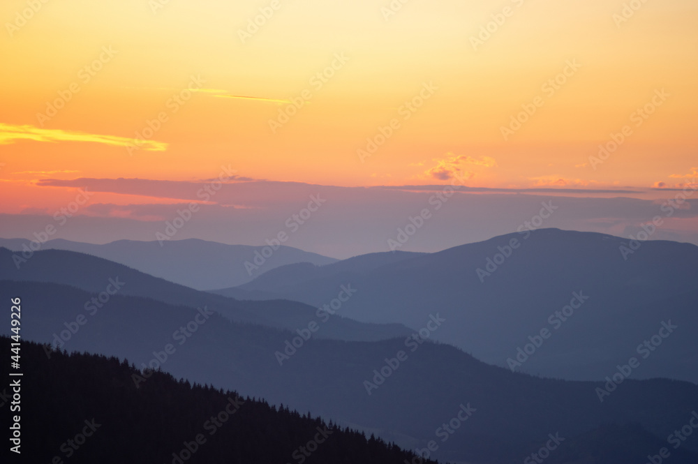 Beautiful orange sky during dusk in the carpathian mountains